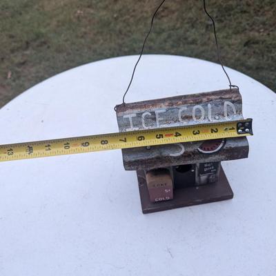 Small hanging birdhouse with metal roof