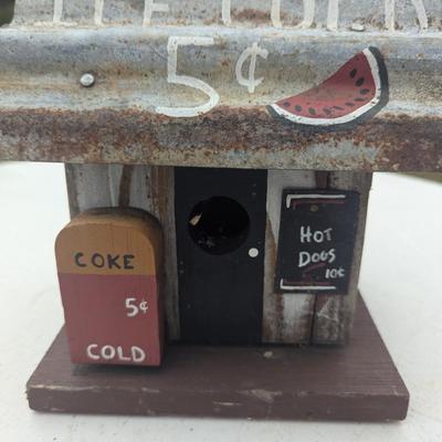 Small hanging birdhouse with metal roof