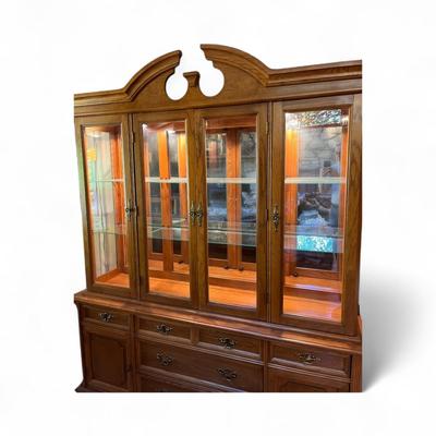 Sale Photo Thumbnail #10: Bassett Furniture  Glass Top China Cabinet.  Lighted Cabinet..   Glass Shelves in upper Cabinet
Approximately 67"X17"X84"   Bottom Section 67"X17"X29.5"  Top Section 64"X14"X55"