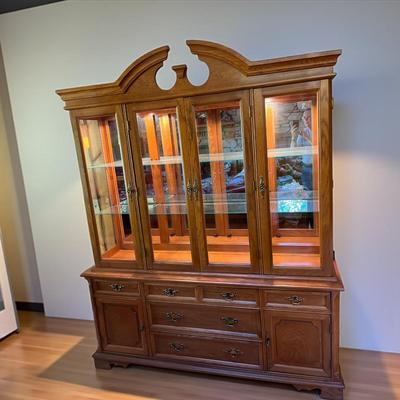 Sale Photo Thumbnail #13: Bassett Furniture  Glass Top China Cabinet.  Lighted Cabinet..   Glass Shelves in upper Cabinet
Approximately 67"X17"X84"   Bottom Section 67"X17"X29.5"  Top Section 64"X14"X55"