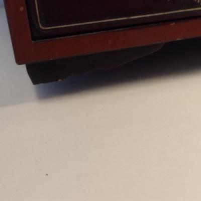 Sale Photo Thumbnail #564: Antique Chinese Wooden Storage Box with Mother of Pearl Inlay- Approx 17 1/2" x  8 3/4" x 16" Tall.  Back is drilled for possible wall hanging.  One foot/leg needs repair- please see all pictures for condition.