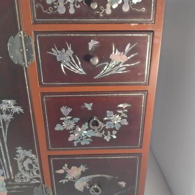 Sale Photo Thumbnail #563: Antique Chinese Wooden Storage Box with Mother of Pearl Inlay- Approx 17 1/2" x  8 3/4" x 16" Tall.  Back is drilled for possible wall hanging.  One foot/leg needs repair- please see all pictures for condition.