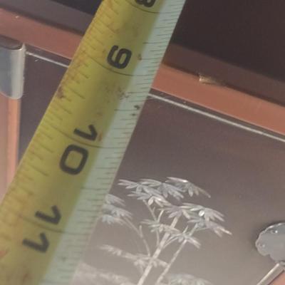 Sale Photo Thumbnail #579: Antique Chinese Wooden Storage Box with Mother of Pearl Inlay- Approx 17 1/2" x  8 3/4" x 16" Tall.  Back is drilled for possible wall hanging.  One foot/leg needs repair- please see all pictures for condition.