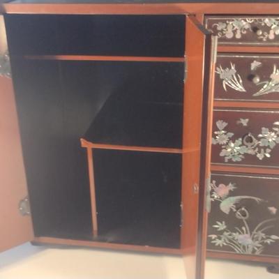 Sale Photo Thumbnail #565: Antique Chinese Wooden Storage Box with Mother of Pearl Inlay- Approx 17 1/2" x  8 3/4" x 16" Tall.  Back is drilled for possible wall hanging.  One foot/leg needs repair- please see all pictures for condition.