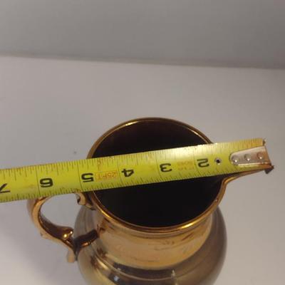 Sale Photo Thumbnail #611: Antique English Lusterware Pitcher- Copper Color with Cream Band- Approx 6" Tall.  Small chip on bottom of handle.