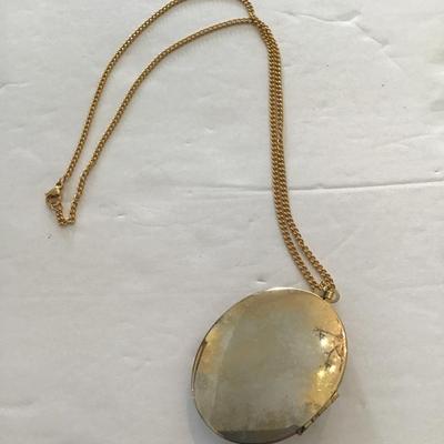 Sale Photo Thumbnail #20: Very nice gold tone, locket with polished green stone. Please see attached photos.