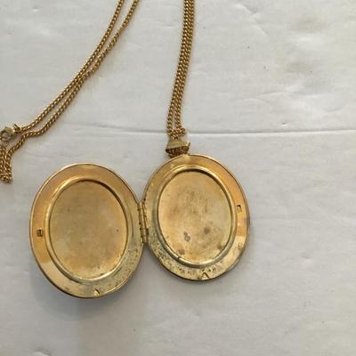 Sale Photo Thumbnail #19: Very nice gold tone, locket with polished green stone. Please see attached photos.