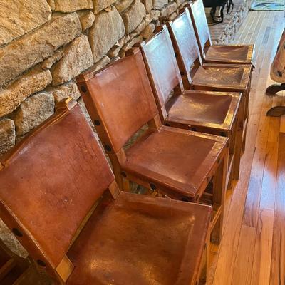Sale Photo Thumbnail #119: Rustic Barstools with Wood Frame and Leather Seating Surface  Lot Of 5
Approximately Seating 26" High   Back 40" High  Damage to two of the Stools  See Photos
