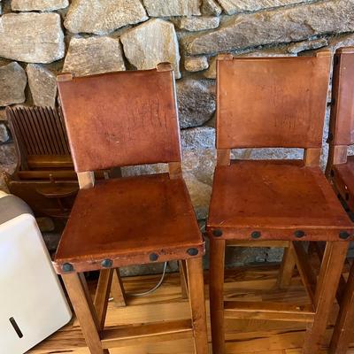 Sale Photo Thumbnail #120: Rustic Barstools with Wood Frame and Leather Seating Surface  Lot Of 5
Approximately Seating 26" High   Back 40" High  Damage to two of the Stools  See Photos