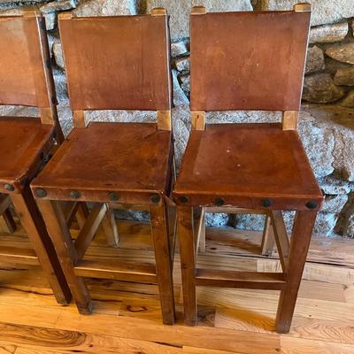 Sale Photo Thumbnail #121: Rustic Barstools with Wood Frame and Leather Seating Surface  Lot Of 5
Approximately Seating 26" High   Back 40" High  Damage to two of the Stools  See Photos
