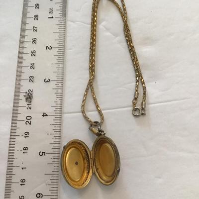 Sale Photo Thumbnail #37: Vintage picture locket has wear blemishes please see attached photos
