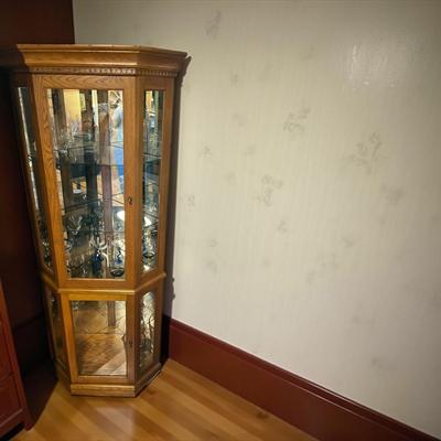 Sale Photo Thumbnail #134: Lighted Corner Curio Cabinet With Glass Shelves and Two Front Doors
Approximately 30"X73"