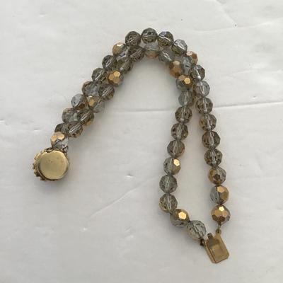 Sale Photo Thumbnail #55: Vintage smoke gold colored crystal bracelet. Please see attached photos.