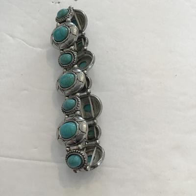 Sale Photo Thumbnail #77: Silvertone faux turquoise stretchy bracelet. Please see attached photos.