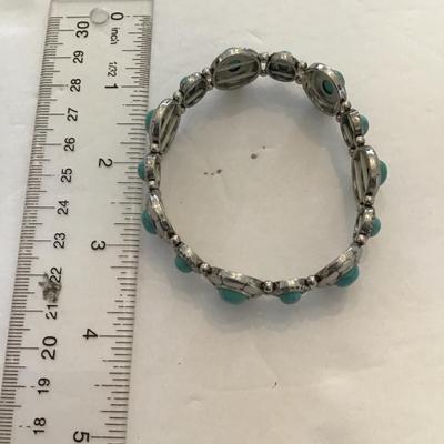 Sale Photo Thumbnail #76: Silvertone faux turquoise stretchy bracelet. Please see attached photos.