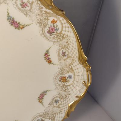 Sale Photo Thumbnail #710: Limoges France Porcelain Gilt Serving Plate- Approx 13 1/4" in Diameter.  Plate stand not included.