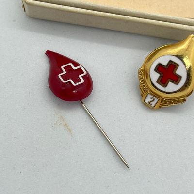 LOT 26: Vintage Red Cross Pins - One is Sterling and still in the package!