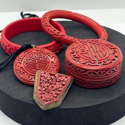 LOT 47: Vintage Carved Chinese Cinnabar Bracelets, Medallion, Pin and Trinket Box