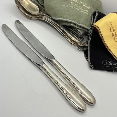 LOT 55: Silver Plated Flatware Pieces with Silver Protectors
