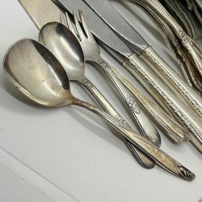LOT 55: Silver Plated Flatware Pieces with Silver Protectors