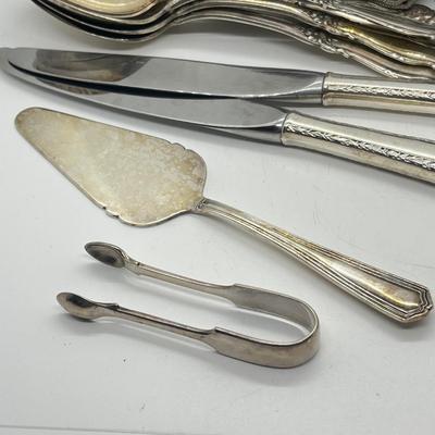 LOT 55: Silver Plated Flatware Pieces with Silver Protectors
