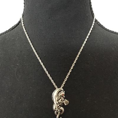 Dragon, red crystal eyes, and a crystal ball pendant necklace. Very nice silver tone, chain necklace.