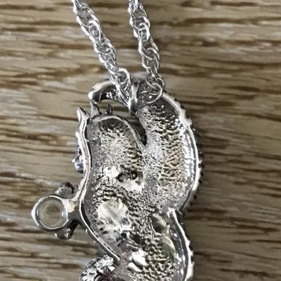 Dragon, red crystal eyes, and a crystal ball pendant necklace. Very nice silver tone, chain necklace.