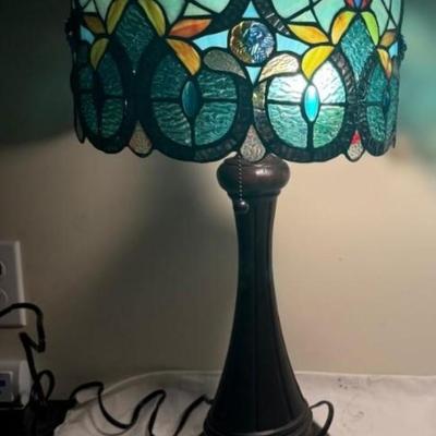 Sale Photo Thumbnail #327: TIffany style glass drum shade lamp.  Corded, bronze bases.  
The oval shape shade has 300 glass pieces.  
12 x 12 x 21 inches . excellent condition.