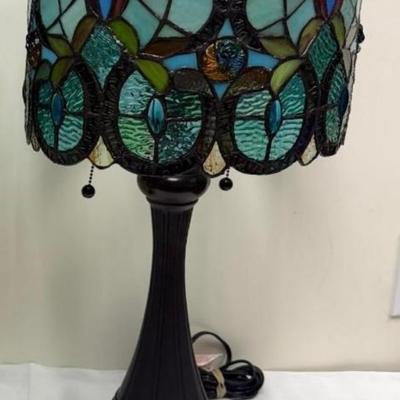 Sale Photo Thumbnail #328: TIffany style glass drum shade lamp.  Corded, bronze bases.  
The oval shape shade has 300 glass pieces.  
12 x 12 x 21 inches . excellent condition.