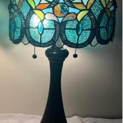 Sale Photo Thumbnail #329: TIffany style glass drum shade lamp.  Corded, bronze bases.  
The oval shape shade has 300 glass pieces.  
12 x 12 x 21 inches . excellent condition.