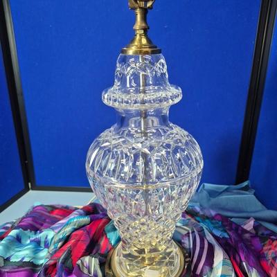 Sale Photo Thumbnail #331: Cut crystal, the body shape is that of an urn, with brass base and socket. 
Araglin is known for fine cut crystal with X groove cuts.  No lampshade or harp with this lamp.
Very nice condition. 
Retail is `~ $600