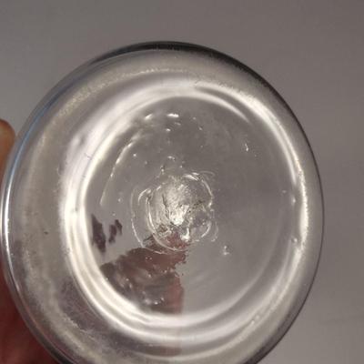 Sale Photo Thumbnail #795: Art Glass Decanter with Stopper.  Item has chipping on stopper- please see all pictures for condition.