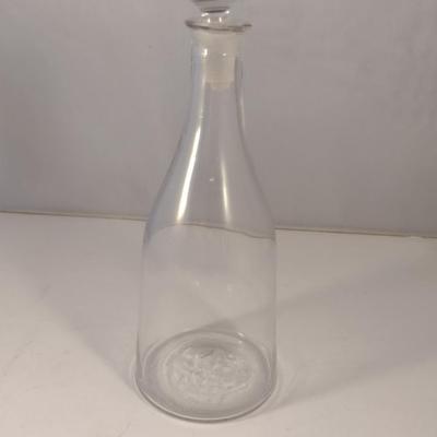 Sale Photo Thumbnail #788: Art Glass Decanter with Stopper.  Item has chipping on stopper- please see all pictures for condition.