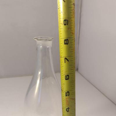 Sale Photo Thumbnail #797: Art Glass Decanter with Stopper.  Item has chipping on stopper- please see all pictures for condition.