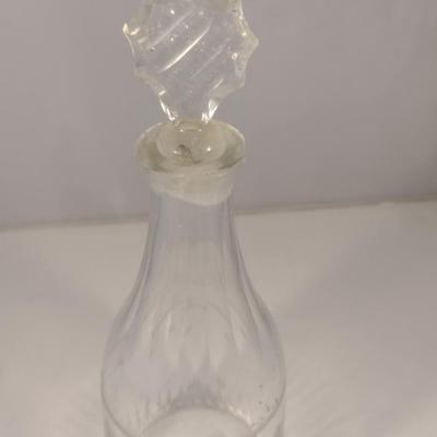 Sale Photo Thumbnail #800: Art Glass Decanter with Stopper- Etched Dainty Design- Approx 10 3/4" Tall.  Stopper has chipping.