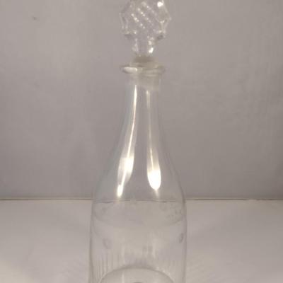 Sale Photo Thumbnail #799: Art Glass Decanter with Stopper- Etched Dainty Design- Approx 10 3/4" Tall.  Stopper has chipping.