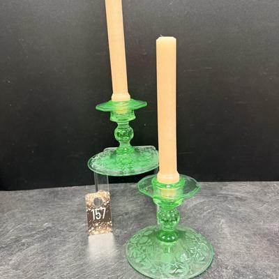 Sale Photo Thumbnail #337: 2 Green depression uranium glass candlesticks excellent condition.
Circa 1930s  Glows under blacklight.
4 inches tall, 4.75 inches wide