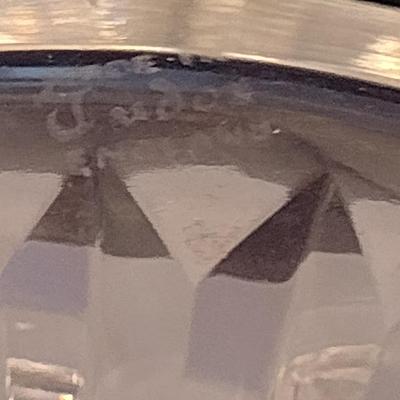 Sale Photo Thumbnail #815: Vintage Signed Tudor England Crystal Decanter with Stopper- Approx 9" Tall.  Item appears to be in good condition.