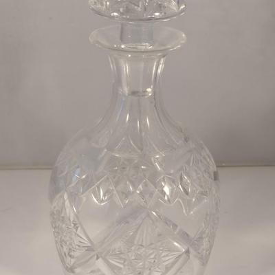 Sale Photo Thumbnail #812: Vintage Signed Tudor England Crystal Decanter with Stopper- Approx 9" Tall.  Item appears to be in good condition.