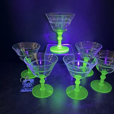 Sale Photo Thumbnail #339: Circa 1930s, green stem, etched glass
Set of 6.   2 have one  minor 'flea bite' on the rim 
4.5 inches tall by 3.5 inch diameter