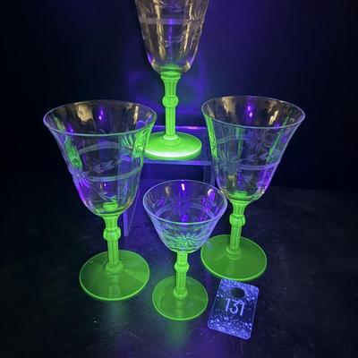Sale Photo Thumbnail #341: 3 + 1 green stem uranium glasses, circa 1930
1 cordial, 4.5 inches by 2.5 inches 
3 wine glasses, 6 7/8 inches by 3.5 inches 
etched bowl