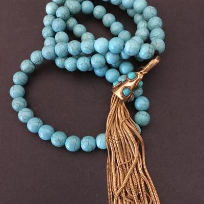 Faux turquoise stone bead, long necklace with vintage gold tone, tassel pendant