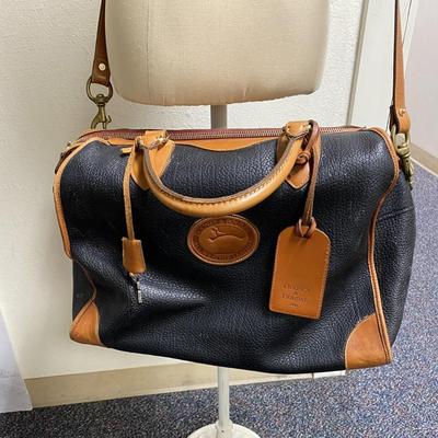 Sale Photo Thumbnail #365: 4 internal pockets
1 internal zipper pocket
2 handles and 1 shoulder strap
Brown all weather leather
Lock with keys
retail $540
very good condition 
12 inches tall x 17 inches wide  by 9.5 inches deep