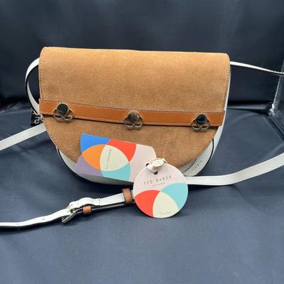 Sale Photo Thumbnail #369: Tan-browm
1 internal and 1 external pocket
1 handle 
NEW
10 inches by 30 inches