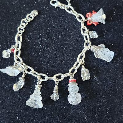 Sale Photo Thumbnail #373: 8 inches long
The charms have markings that resemble frost on glass