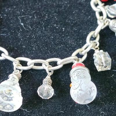 Sale Photo Thumbnail #374: 8 inches long
The charms have markings that resemble frost on glass