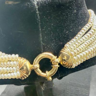 Sale Photo Thumbnail #55: 8-strand freshwater seed pearl necklace with a 14K gold clasp. Clasp is marked "ADPG" and "14K". Overall necklace weight is 55g.  Excellent condition.