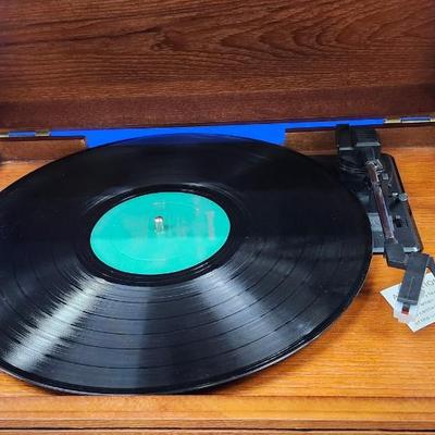 Sale Photo Thumbnail #382: Retro all in one music system.
3 speed turntable   33  45  78  
CD player, cassette payer
AM  FM  radio
built in Bluetooth receiver for streaming 
NEW