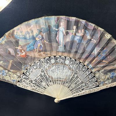 Sale Photo Thumbnail #391: Professionally framed, 25 x 29 3/4 inches
The top fan is Spanish origin, the bottom fan is French.  
Amazing hand painted antique fans, you will be stunned at the details.

The Spanish fan is likely from the 18th or 19th century, featuring carved and pier