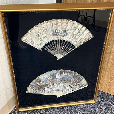 Sale Photo Thumbnail #394: Professionally framed, 25 x 29 3/4 inches
The top fan is Spanish origin, the bottom fan is French.  
Amazing hand painted antique fans, you will be stunned at the details.

The Spanish fan is likely from the 18th or 19th century, featuring carved and pier